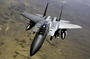 An F-15E Strike Eagle aircraft in flight over Afghanistan An F-15E Strike Eagle aircraft in flight over Afghanistan