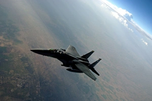An F-15E Strike Eagle breaks away from a KC-135 Stratotanker after refueling An F-15E Strike Eagle breaks away from a KC-135 Stratotanker after refueling