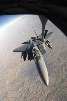 A F-15E Strike Eagle gets refueled by a KC-135T Stratotanker A F-15E Strike Eagle gets refueled by a KC-135T Stratotanker