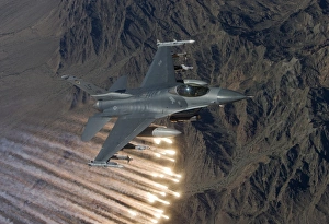 An F-16 Fighting Falcon releases flares during a training mission An F-16 Fighting Falcon releases flares during a training mission