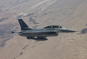 An F-16 maneuvers during a training mission over Arizona An F-16 maneuvers during a training mission over Arizona