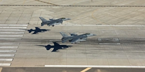 Two F-16s land in formation at Luke Air Force Base, Arizona Two F-16s land in formation at Luke Air Force Base, Arizona