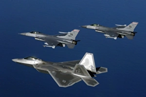 Three F-22A Raptor aircrafts fly in formation Three F-22A Raptor aircrafts fly in formation
