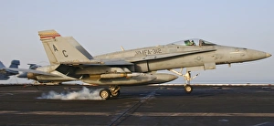 An F/A-18 Hornet lands aboard USS Harry S. Truman An F/A-18 Hornet lands aboard USS Harry S. Truman