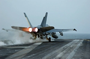 An F/A-18 Hornet launches from the flight deck aboard USS Theodore Roosevelt An F/A-18 Hornet launches from the flight deck aboard USS Theodore Roosevelt