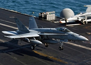 An F/A-18 Hornet makes an arrested landing aboard aircraft carrier USS Theodore Roosevelt An F/A-18 Hornet makes an arrested landing aboard aircraft carrier USS Theodore Roosevelt