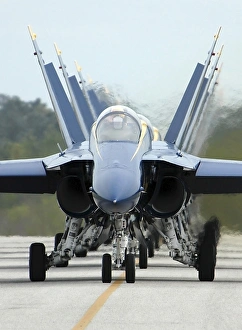 F/A-18A Hornets assigned to the Blue Angels, taxi back to their flight line F/A-18A Hornets assigned to the Blue Angels, taxi back to their flight line