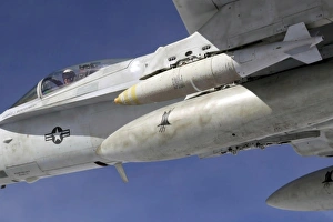 An F/A-18C Hornet flies over the Pacific Missile Range Facility An F/A-18C Hornet flies over the Pacific Missile Range Facility