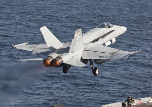 An F/A-18C Hornet taking off during flight operations on USS Dwight D. Eisenhower An F/A-18C Hornet taking off during flight operations on USS Dwight D. Eisenhower