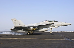An F/A-18E Super Hornet lands aboard USS Harry S. Truman An F/A-18E Super Hornet lands aboard USS Harry S. Truman