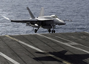 An F/A-18E Super Hornet prepares to land on the flight deck aboard USS Dwight D An F/A-18E Super Hornet prepares to land on the flight deck aboard USS Dwight D