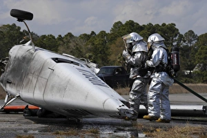 Firefighters respond to the scene of a simulated plane crash Firefighters respond to the scene of a simulated plane crash