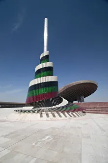 A flagpole covered in plates of Murano glass with the Monument to the Unknown Soldier A flagpole covered in plates of Murano glass with the Monument to the Unknown Soldier
