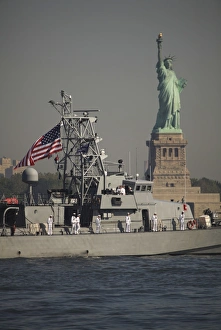 Fleet week vessels pass by the Statue of Liberty Fleet week vessels pass by the Statue of Liberty