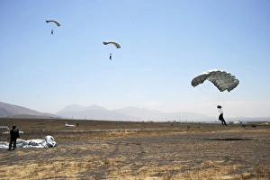 Freefall parachute jumpers approaching the Trident drop zone in San Diego Freefall parachute jumpers approaching the Trident drop zone in San Diego