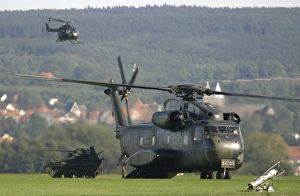 A German CH-53G helicopter unloads a Wiesel armored vehicle A German CH-53G helicopter unloads a Wiesel armored vehicle