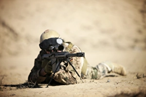 A German soldier sights in a Barrett M82A1 rifle A German soldier sights in a Barrett M82A1 rifle