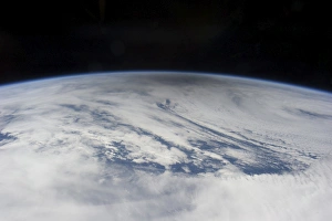 The gray shadow of the moon cast on bright clouds of the northern Pacific Ocean The gray shadow of the moon cast on bright clouds of the northern Pacific Ocean