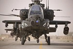 Ah 64 Collection: A group of AH-64D Apache helicopters on the runway at COB Speicher