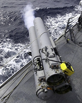 The guided missile destroyer USS Mustin (DDG-89), test fires the MK-32 Mod-15 Torpedo The guided missile destroyer USS Mustin (DDG-89), test fires the MK-32 Mod-15 Torpedo