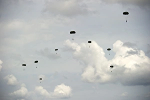 HALO jumpers descend to the ground after exiting a C-17 Globemaster III HALO jumpers descend to the ground after exiting a C-17 Globemaster III