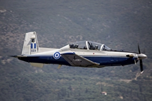 A Hellenic Air Force T-6 trainer flying over Kalamata, Greece A Hellenic Air Force T-6 trainer flying over Kalamata, Greece