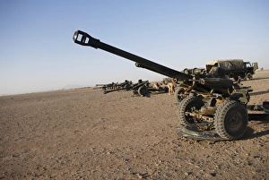 Howitzer 105mm light guns are lined up at Camp Bastion, Afghanistan Howitzer 105mm light guns are lined up at Camp Bastion, Afghanistan