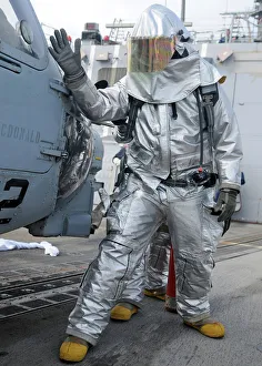 Hull Maintenance Technician checks an SH-60B Sea Hawk helicopter Hull Maintenance Technician checks an SH-60B Sea Hawk helicopter