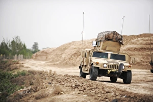 A Humvee conducts security during a patrol in the Iraqi village of Bakr A Humvee conducts security during a patrol in the Iraqi village of Bakr