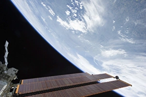 International Space Station solar array panels and planet Earth International Space Station solar array panels and planet Earth