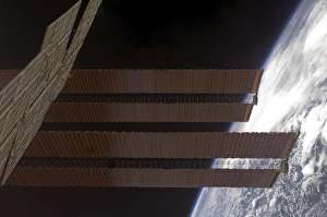 International Space Stations solar array panels and Earths horizon International Space Stations solar array panels and Earths horizon