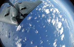 A KC-135 Stratotanker refuels a B-2 Spirit over the Pacific Ocean A KC-135 Stratotanker refuels a B-2 Spirit over the Pacific Ocean