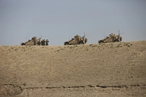 Three M-ATVs guard the top of the wadi near Kunduz, Afghanistan Three M-ATVs guard the top of the wadi near Kunduz, Afghanistan