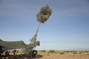 The M982 Excalibur 155mm round leaves the barrel of an M777 Howitzer The M982 Excalibur 155mm round leaves the barrel of an M777 Howitzer