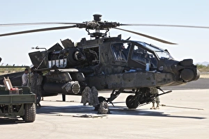 Maintenance being conducted on an AH-64D Apache Longbow Maintenance being conducted on an AH-64D Apache Longbow