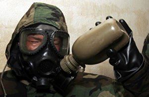 A marine drinks water from a canteen A marine drinks water from a canteen