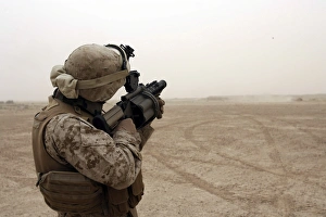 A Marine fires the M-32 Multiple shot Grenade Launcher A Marine fires the M-32 Multiple shot Grenade Launcher