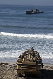 Marines anticipate the arrival of an Improved Navy Lighterage System Marines anticipate the arrival of an Improved Navy Lighterage System
