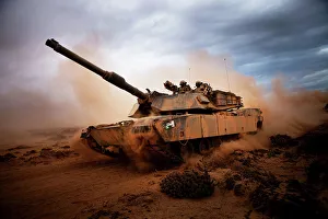 Marines roll down a dirt road on their M1A1 Abrams Main Battle Tank Marines roll down a dirt road on their M1A1 Abrams Main Battle Tank