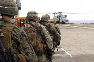 Marines and sailors progress to board a CH-53E Super Stallion Marines and sailors progress to board a CH-53E Super Stallion