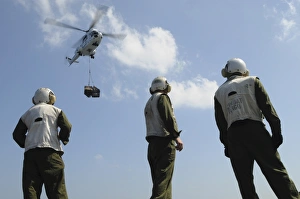 Marines wait to retrieve a pallet during a vertical replenishment Marines wait to retrieve a pallet during a vertical replenishment
