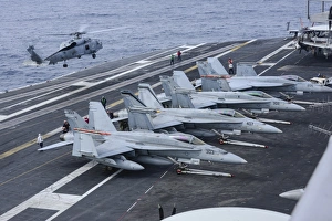 An MH-60R Sea Hawk lands on the flight deck of USS Carl Vinson An MH-60R Sea Hawk lands on the flight deck of USS Carl Vinson