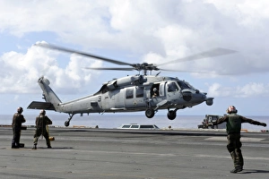 An MH-60S Sea Hawk lands on the flight deck of USS John C. Stennis An MH-60S Sea Hawk lands on the flight deck of USS John C. Stennis