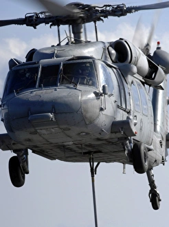 An MH-60S Seahawk delivers a pallet of MK 83/BLU-110 general-purpose bombs An MH-60S Seahawk delivers a pallet of MK 83/BLU-110 general-purpose bombs