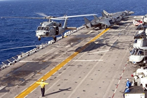 An MH-60S Seahawk helicopter prepares to land aboard USS Makin Island An MH-60S Seahawk helicopter prepares to land aboard USS Makin Island