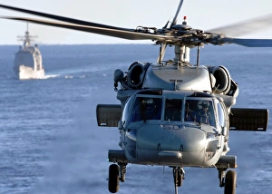 An MH-60S Seahawk helps conduct a vertical replenishment An MH-60S Seahawk helps conduct a vertical replenishment