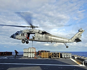 An MH-60S Seahawk prepares to deliver ammunition An MH-60S Seahawk prepares to deliver ammunition