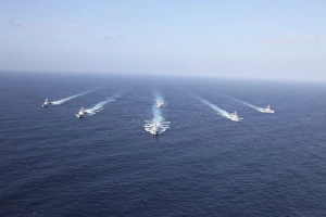 Military ships transit the Philippine Sea in formation Military ships transit the Philippine Sea in formation