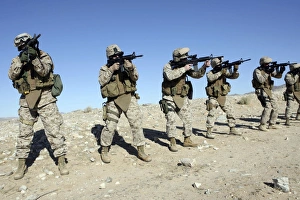 Military Transistion Team members quickly reload their rifles Military Transistion Team members quickly reload their rifles