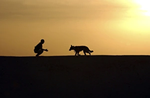 A military working dog and his handler spend time together A military working dog and his handler spend time together